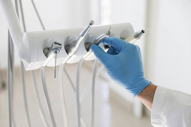 Professional Tooth Extraction technician working in Medford, MA